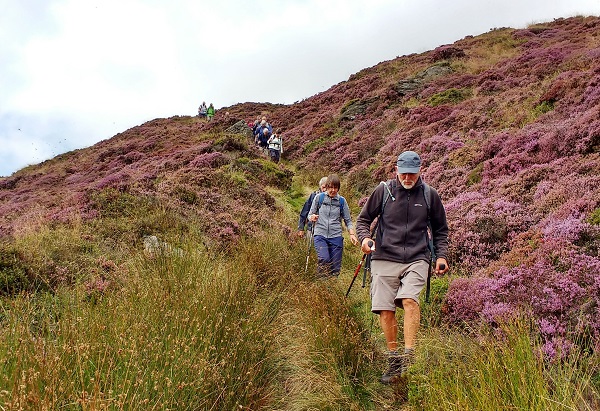 Walkers descending towards Ollerbrook Clough